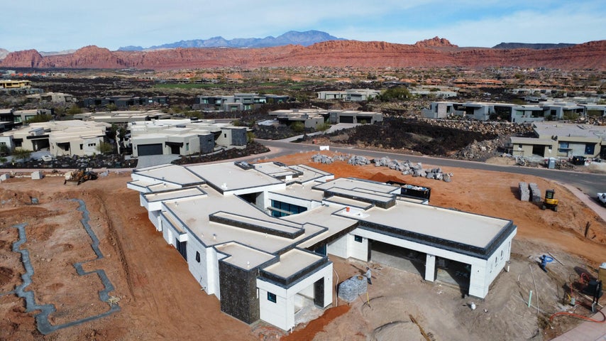 Aerial view of residential area with a mountainous background
