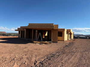View of front of house featuring stucco siding