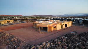 View of subject property with a mountain backdrop