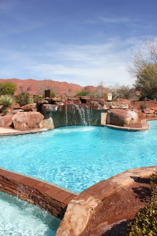 Community pool with a mountain view