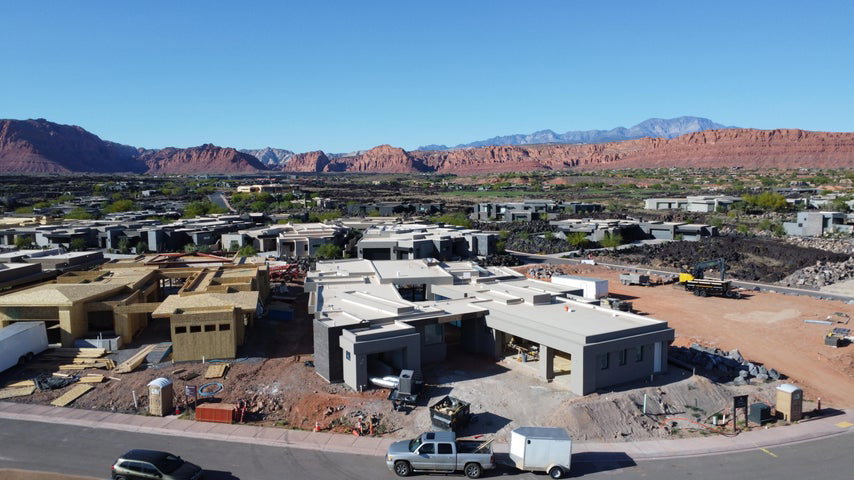 Aerial view of residential area featuring mountains