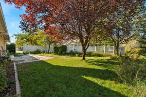 Fenced backyard featuring a patio