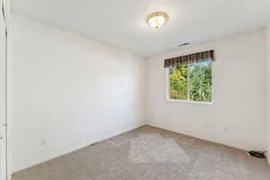 Spare room with carpet flooring and baseboards