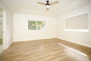 Spare room featuring light wood-style flooring and a ceiling fan