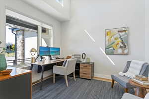 Office featuring baseboards and dark wood-style floors