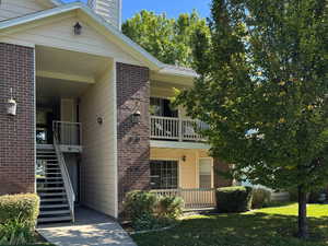 View of property with stairs