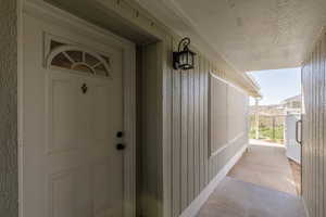 Property entrance with covered porch