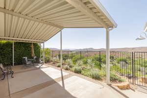 View of patio / terrace featuring a mountain view and outdoor dining area