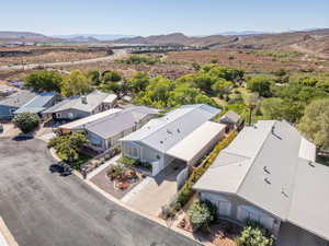 Aerial view of residential area featuring a mountainous background