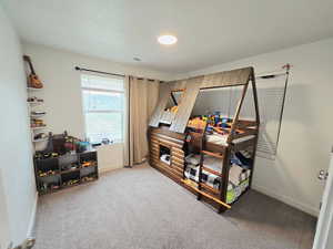 Bedroom with carpet flooring and baseboards