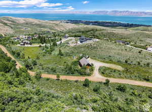 View of property location featuring a water and mountain view