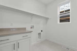 Laundry room featuring washer hookup and electric dryer hookup