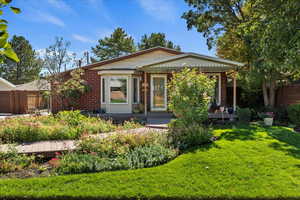 View of front of home featuring brick siding