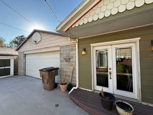 Entrance to property with french doors and driveway