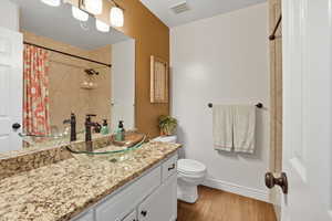Bathroom with granite countertops and tub to ceiling marble shower/tub