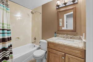 Full bathroom with shower / bathtub combination with tub to ceiling marble and granite countertops