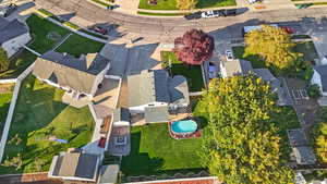 Drone / aerial view of home with  a pool