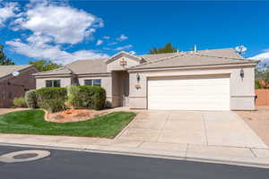 Ranch-style house featuring stucco siding, concrete driveway, a garage, and a tiled roof