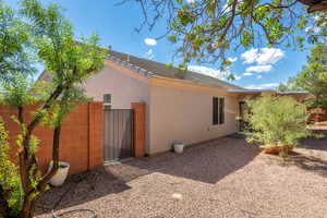 View of side of home featuring stucco siding