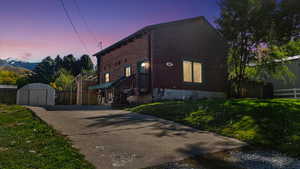 View of home's exterior featuring a storage shed