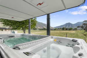 Exterior view of a hot tub and mountains