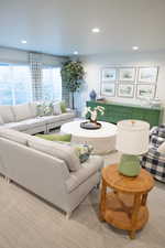 Carpeted living room featuring recessed lighting