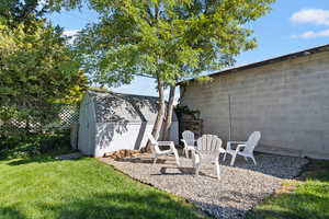 View of yard with a storage unit