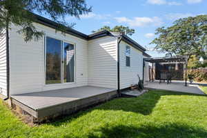 Rear view of property featuring a patio area