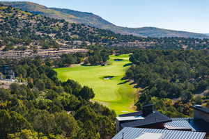 Drone / aerial view of mountains and a local golf course