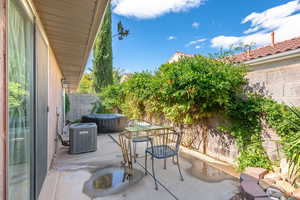 Fenced backyard with a patio and outdoor dining area