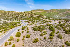 View of rural area with a mountainous background and a desert landscape