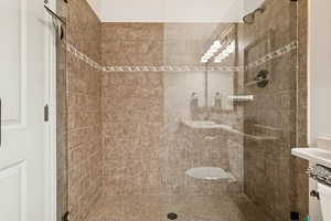 Full bathroom featuring a stall shower