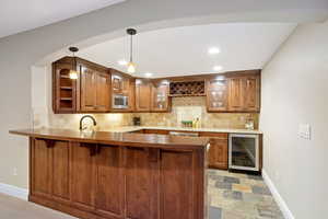 Wet bar with two wine coolers, and bread warming drawer