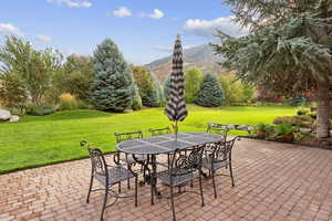 View of patio featuring outdoor dining space and a mountain view