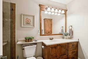 Full bath with vanity and tiled shower, located off 4th bedroom in basement