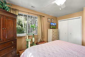 Bedroom featuring a closet and a ceiling fan