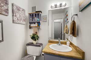 Half bath with vanity and toilet
