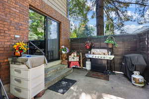 View of patio / terrace with a grill and entry steps