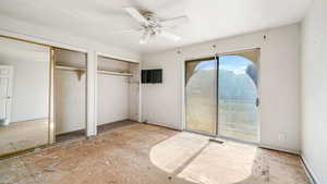 Bedroom 1 with sliding glass door to an outside deck