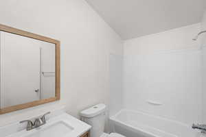 Full bathroom featuring vanity, tub / shower combination, and crown molding