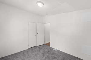 Unfurnished bedroom with carpet floors