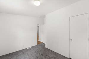 Unfurnished bedroom with carpet and crown molding