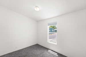 Unfurnished room featuring carpet floors