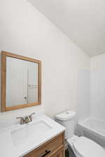 Full bathroom with vanity, shower / tub combination, and ornamental molding