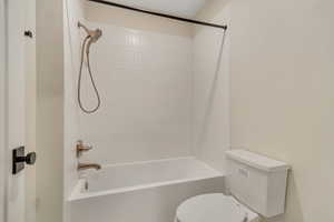 Full bath featuring tub / shower combination and toilet