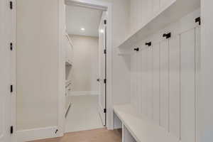 Mudroom featuring recessed lighting and light wood finished floors