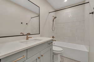 Bathroom featuring vanity and  shower combination
