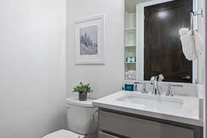 Bathroom featuring vanity and toilet