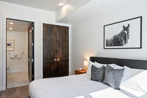 Bedroom featuring recessed lighting and a closet