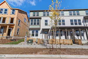 View of front of property with stucco siding and a porch